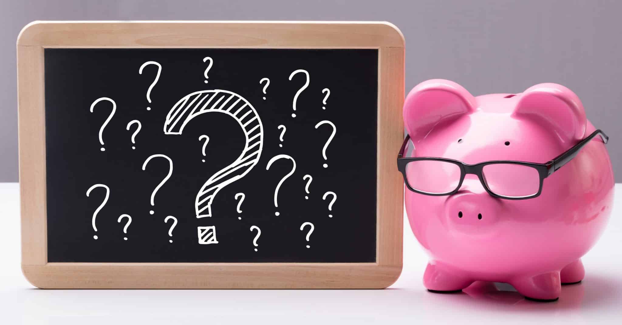 Piggy bank with question marks to represent questioning whether to switch from an IVA to Bankruptcy.