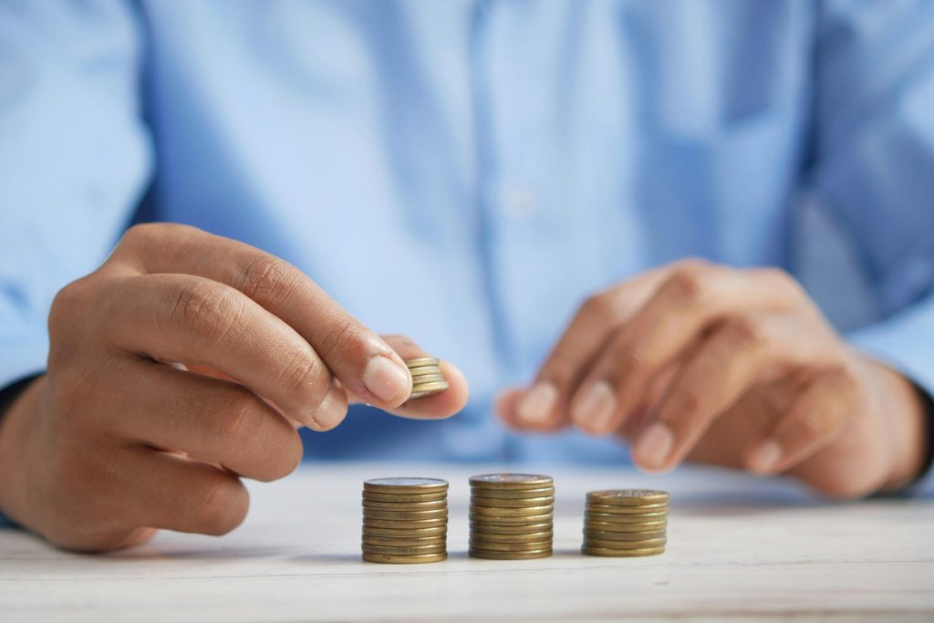 man counting coins - declare bankruptcy uk