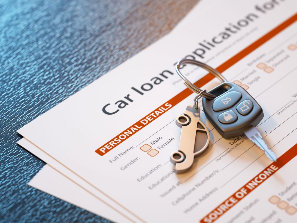 Car loan agreement and car keys highlighting affect of bankruptcy on car finance.