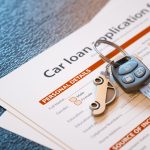 Car loan agreement and car keys highlighting affect of bankruptcy on car finance.