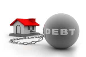 House tied to debt ball and chain showcasing mortgage shortfall and bankruptcy