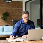 Business man working on computer showcasing whether a company director can go bankrupt