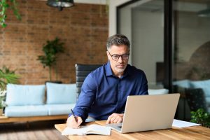 Business man working on computer showcasing whether a company director can go bankrupt