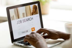 Man browsing work opportunities online to showcase if you are employed can you go bankrupt