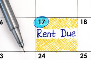 Reminder Rent Due in calendar with pen to showcase if rent arrears can be included in bankruptcy
