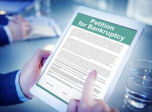 bankrupty application on tablet showcasing what happens when you file for bankruptcy - uk